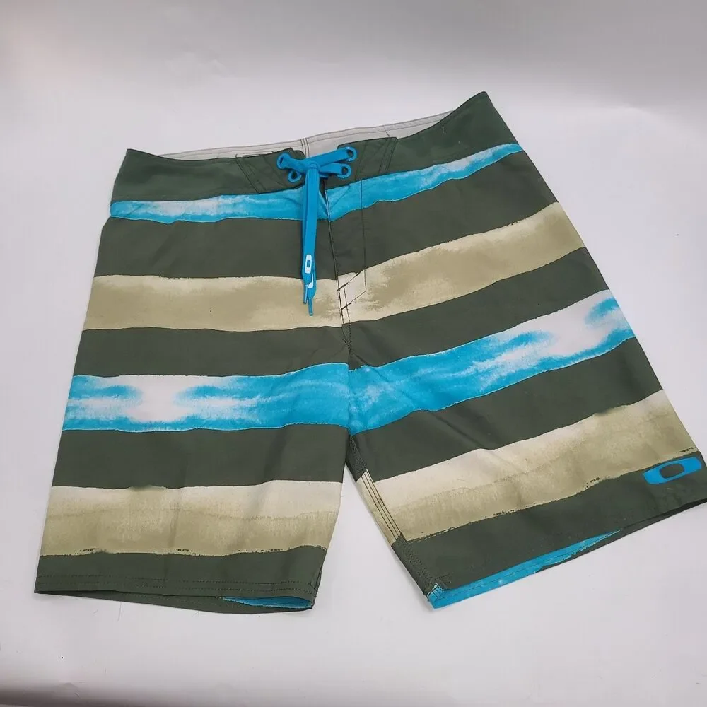 Oakley Crashing Wave board shorts with a multi-color stripe pattern. Men's 34